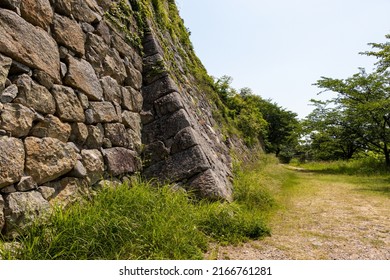 Old And Large Stone Wall In Japanese Castle Ruins