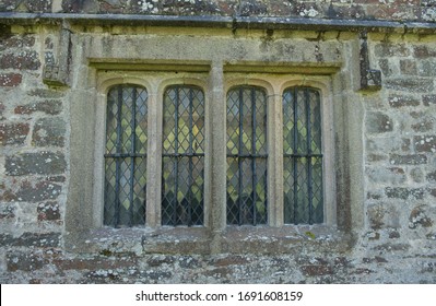 Old Leaded Windows in a Ancient Stone Building at Cotehele in Rural Cornwall, England, UK