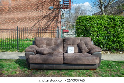 A Old Leather Couch Discarded On Street Side For Free To Be Taken Away 