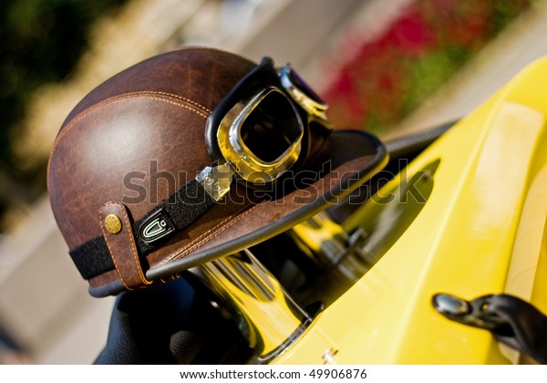 Old leather racing\
helmet with glasses