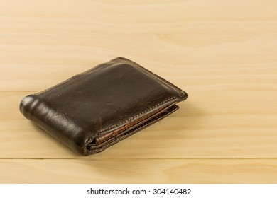 Old Leather Wallet On Wood Table