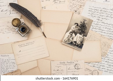 Old Letters, Vintage Postcards And Antique Feather Pen. Nostalgic Sentimental Background With Retro Christmas Postcard