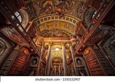 Old library of Vienna with the ceiling paintings and ornaments of the building.