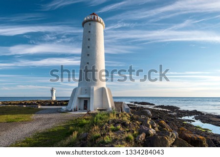 Old Lighthouse of Akranes town, Sudurflos reefs and other lighthouse are at right background. Western coastline of Iceland