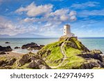 The Old Lighthouse on the tidal Island of Llanddwyn, Anglesey, Wales, UK