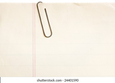 Old Lined Paper With Rusty Paperclip Attached