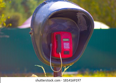 Old lonely payphone in an abandoned village