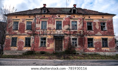 Old, long abandoned and derelict brick house in city Celje. 