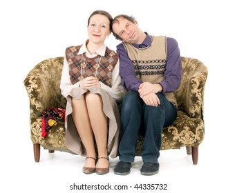 Old Looking Couple In Love Sitting On Retro Couch