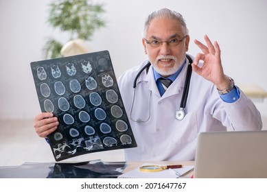 Old Male Doctor Radiologist Working In The Clinic