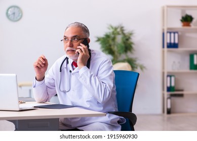 Old Male Doctor In Telemedicine Concept