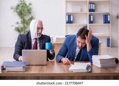 Old Male Employee Suffering From Toothache In The Office