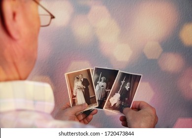 old man’s male hands hold old retro family photos in sepia color and looks at photographs of his and his sisters, made in 1963 - 1964, genealogy concept, ancestral memory, family  - Shutterstock ID 1720473844