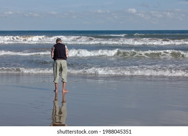 Old Man Alone On The Beach