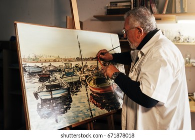 Old man artist painting