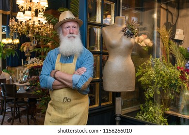 Old Man With Beard, Florist Taking Care Of Flowers In Flower Shop