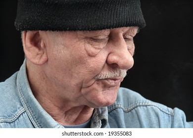 old man in black hat