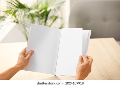 Old Man With Blank Magazine At Home