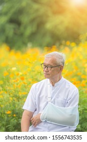 Old Man Broken Arm After Accident With Wear Arm Splint In The Park