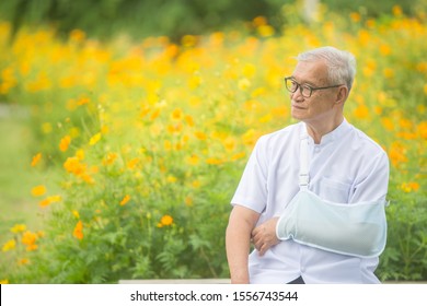 Old Man Broken Arm After Accident With Wear Arm Splint In The Park