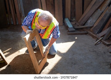 Old Man Carpenter Check Quality Of Wood Frame To Clear Dust On Lighting , Woodworker Industrial 