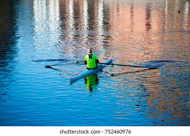 old man in competitive rowing boat - Powered by Shutterstock