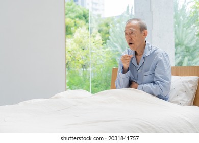 Old Man Coughing In Bed
