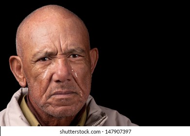 An Old Man Cries Whilst Staring Aimlessly.