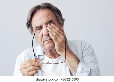 Old Man With Eye Fatigue