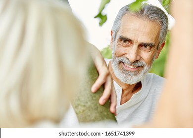 Old Man Flirts With A Woman In Nature In Summer