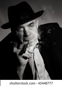 Old Man At Hat With Cigar