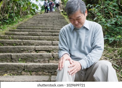 Old Man With Knee Problem In The Moutain