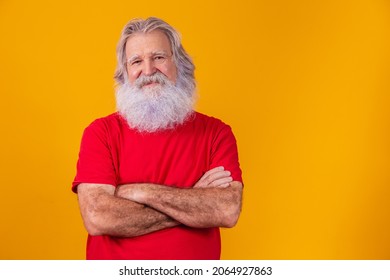 old man with long beard with arms crossed looking at the camera - Powered by Shutterstock