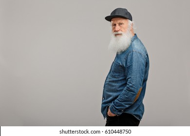 Old Man With A Long Beard On A Grey Background