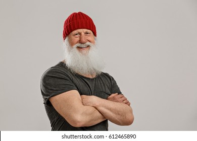 Old Man With A Long Beard On A Grey Background