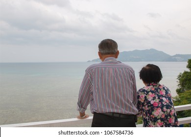 The Old Man Looking At The Sea In Phuket, Thailand. Back View