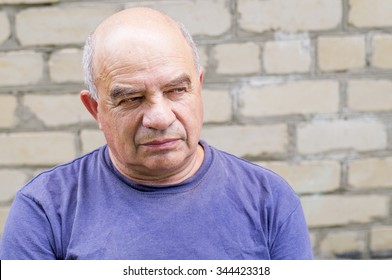 Old Man Looking For Someone With Contempt