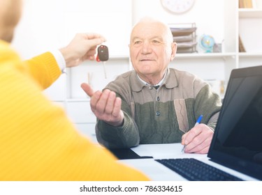 Old Man And Manager Signed Car Purchase Contract At Office And Hand Over Keys