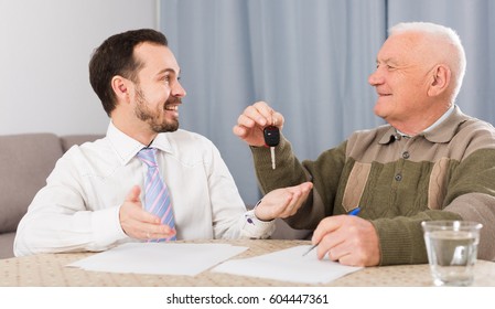 Old Man And Manager Signed Contract Car Lease At Home And Hand Over Keys