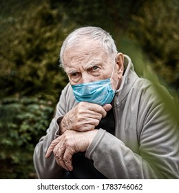 old man in a medical mask in the open air, so as not to get infected with the virus. Prevention of viral diseases. Loneliness of old people - Powered by Shutterstock