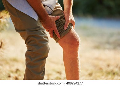 Old Man With Pain On The Knee In The Nature In Summer