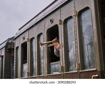 Old Man Play Trumpet Trough A Steam Powered Train