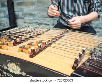 Old Man Playing With Bamboo Hammers On A Modern Yangqin With Five Courses Of Bridges, Beijing, China