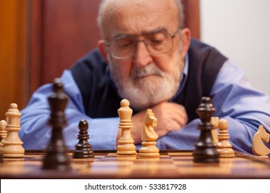 Old Man Playing Chess