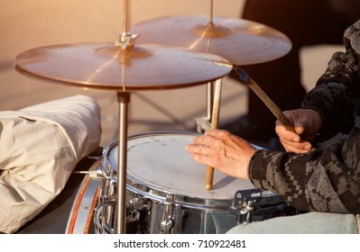 Old Man Playing Drums On Street