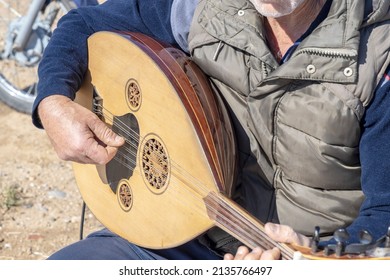 Old Man Playing Exotic String Instrument: Turkish Oud.