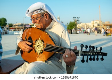 An Old Man In Qatari Clothes Playing Oud, Doha, Qatar, November 16, 2017