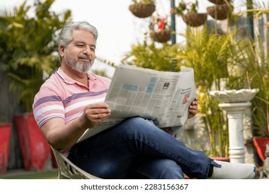 Old man reading news paper. lifestyle concept. - Powered by Shutterstock