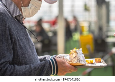 Old Man Ready To Eat Mexican Street Fast Food With Burritos. Man Wearing Facial Mask To Be Protected From Coronavirus