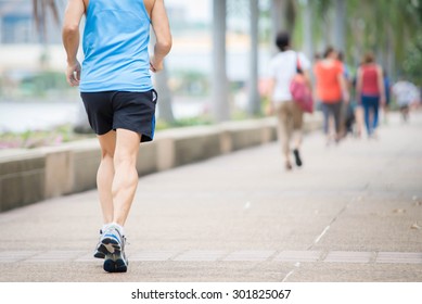 Old Man Running In City Park